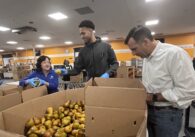 People preparing food donations at a food bank