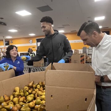 People preparing food donations at a food bank