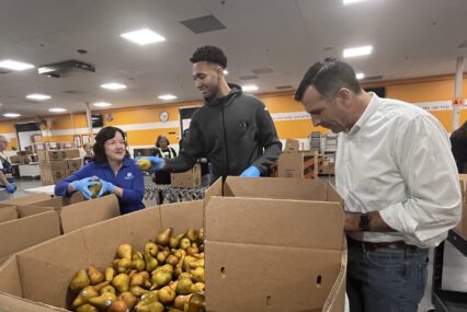 People preparing food donations at a food bank