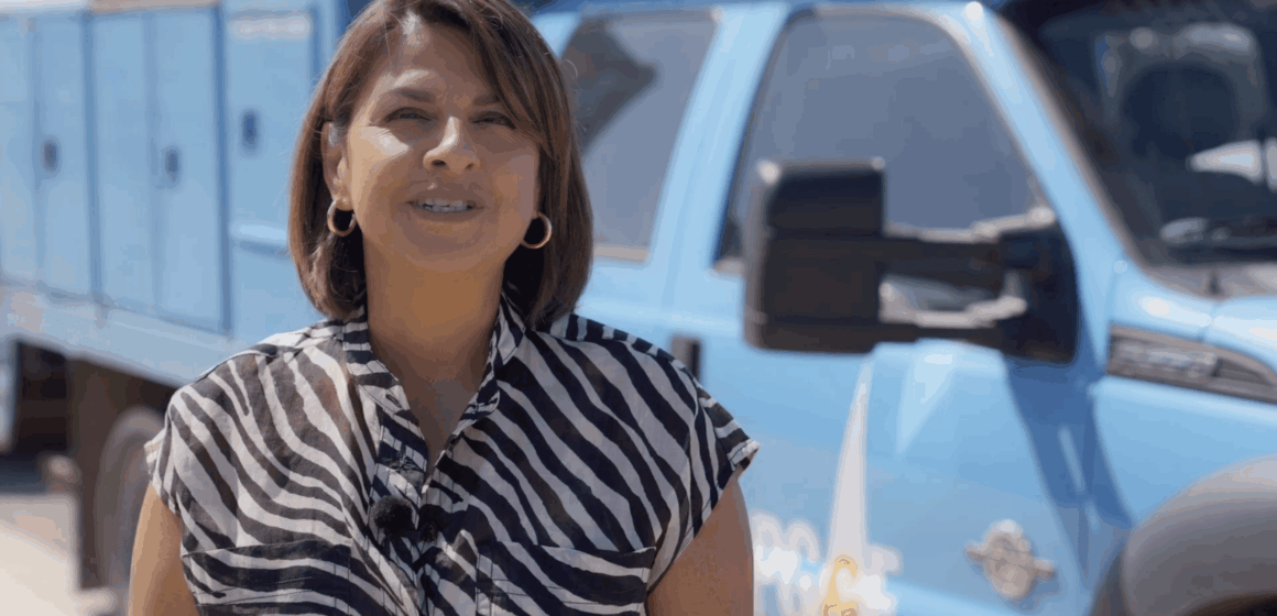 ALVARADO A woman standing in front of a PG&E utility truck
