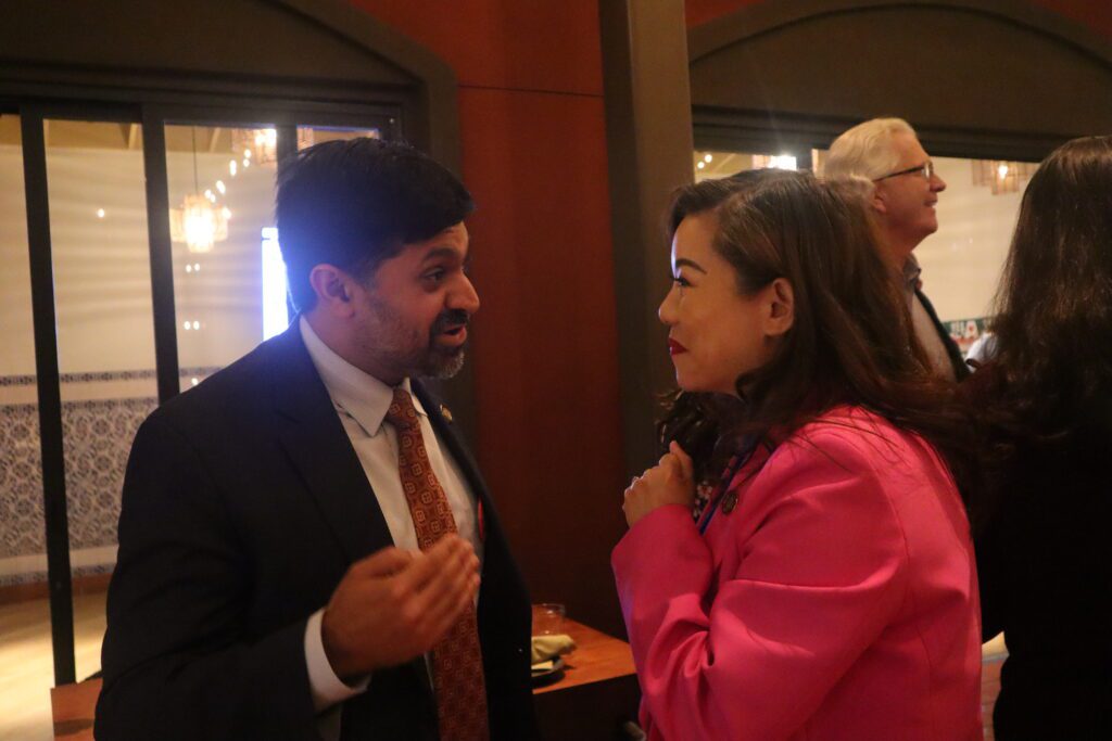 A man and woman speak at an election night watch party in San Jose, California