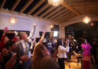 A crowd cheering at an election night watch party in San Jose, California