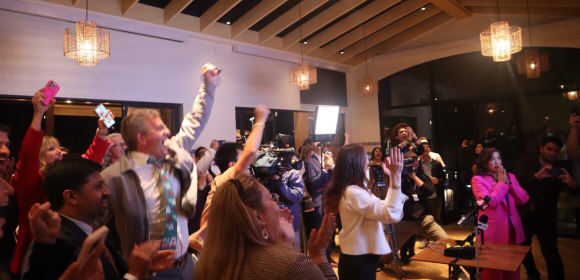 A crowd cheering at an election night watch party in San Jose, California