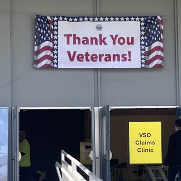 VET RESOURCE FAIR A 'thank you veterans' sign is displayed above a door at a resource fair in San Jose, California