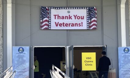 VET RESOURCE FAIR A 'thank you veterans' sign is displayed above a door at a resource fair in San Jose, California