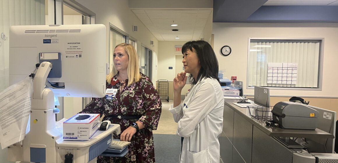 SOBRATO Two health care workers look at a computer in a hospital in San Jose, California