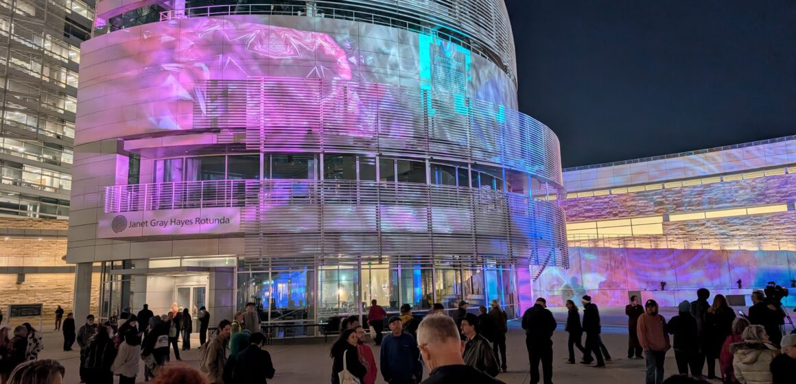 A crowd at San Jose City Hall in the evening