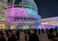 A crowd at San Jose City Hall in the evening