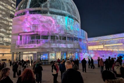 A crowd at San Jose City Hall in the evening