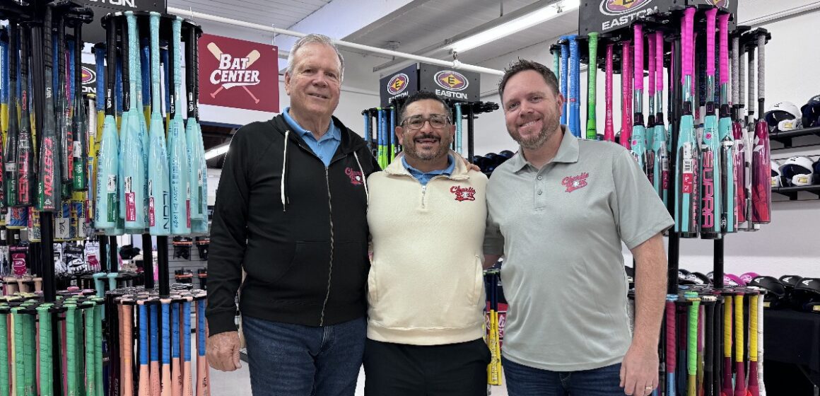 Charlie Rose Baseball Three men standing inside a baseball shop in San Jose, California