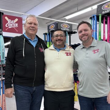 Charlie Rose Baseball Three men standing inside a baseball shop in San Jose, California