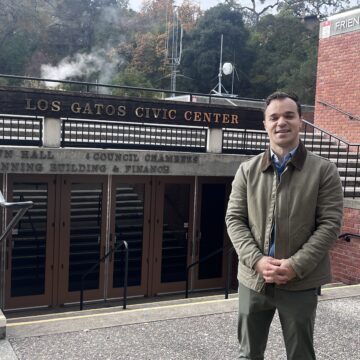 A man stands in front of city hall in Los Gatos, California