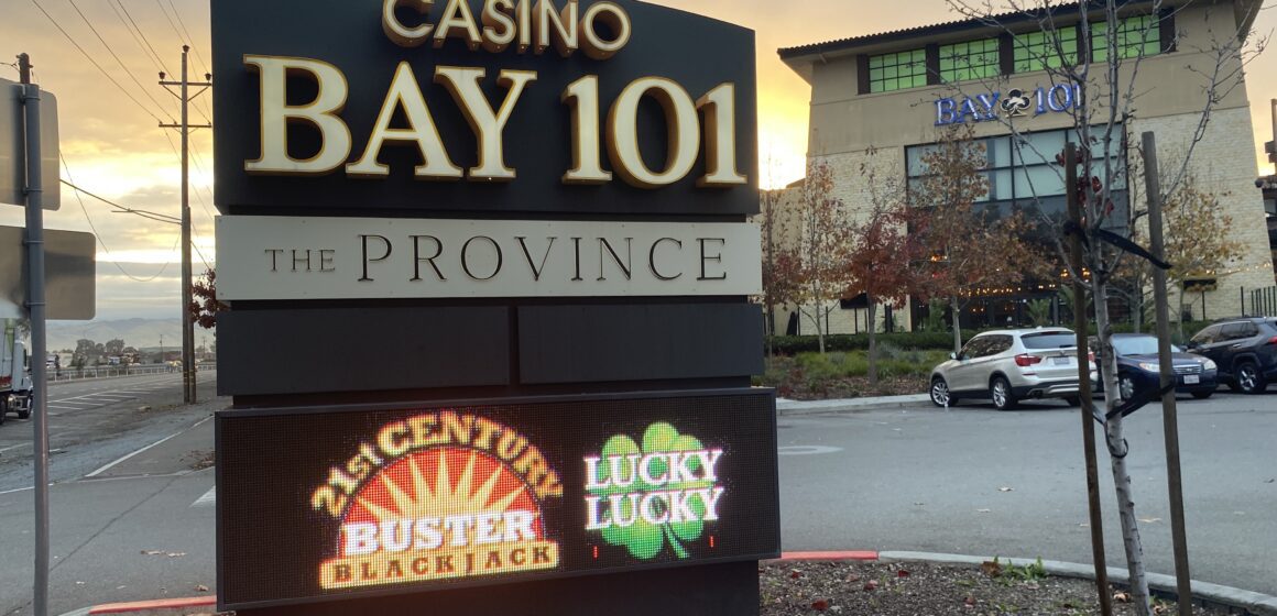 A digital sign for Bay 101 Casino in front of the parking lot for the casino.