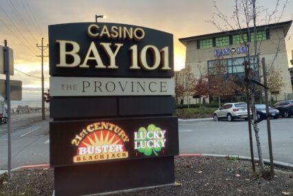 A digital sign for Bay 101 Casino in front of the parking lot for the casino.