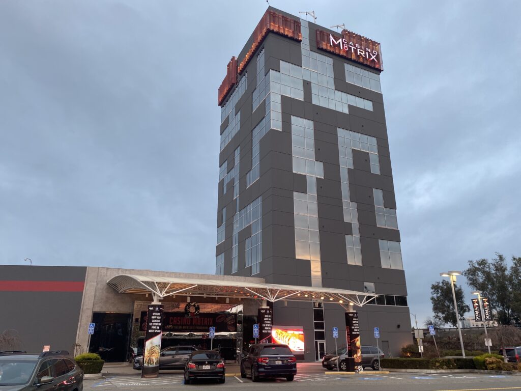 A towering high rise that houses a card room.