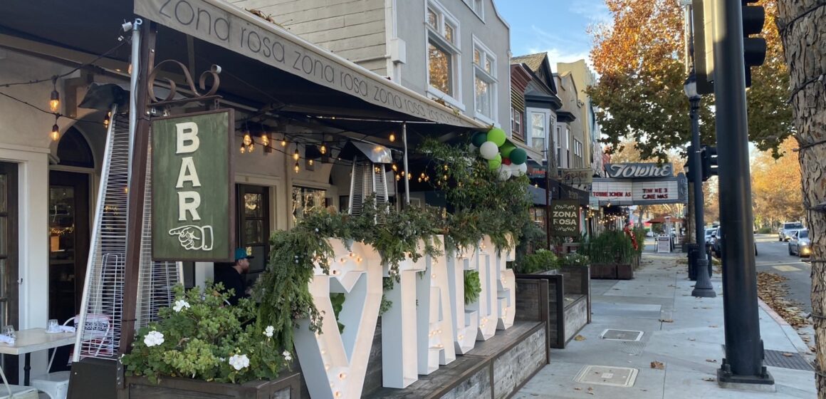 Restaurants and other businesses line a local thoroughfare.