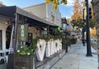 Restaurants and other businesses line a local thoroughfare.