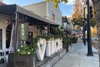 Restaurants and other businesses line a local thoroughfare.