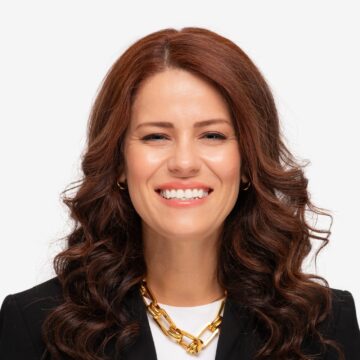 A woman smiles in a professional headshot.