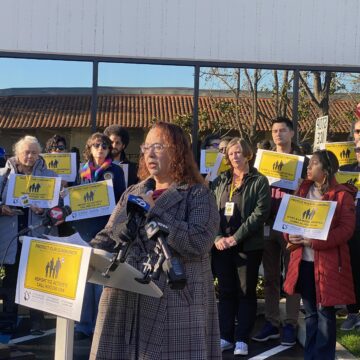 MINNESOTA ICE SHOOTING--Rebecca Armendariz A woman speaks at a podium in San Jose, California