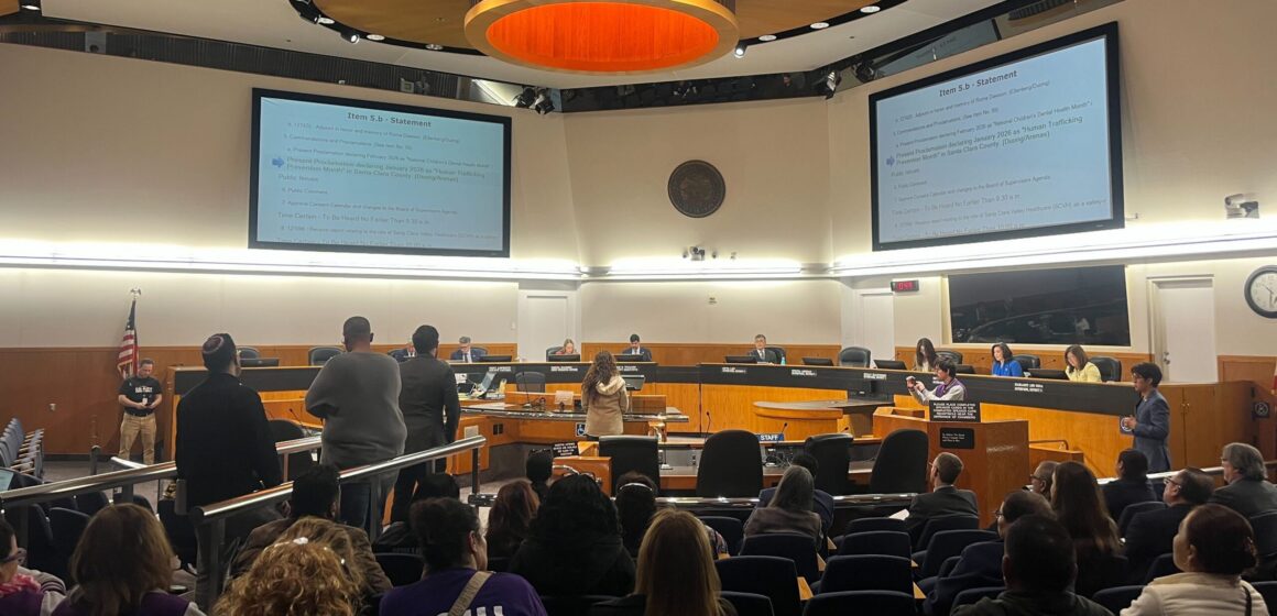 People in audience seating at a government meeting in Santa Clara County, California
