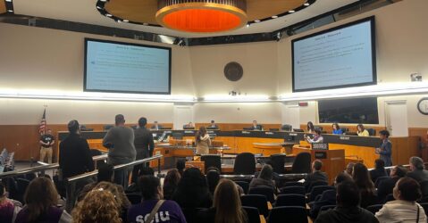 People in audience seating at a government meeting in Santa Clara County, California