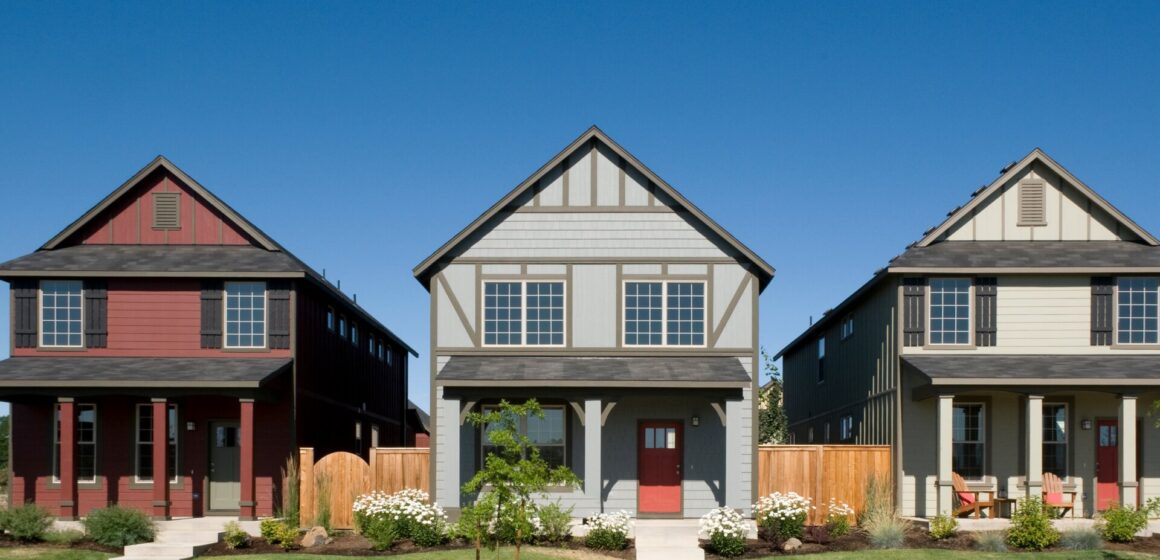 A rendering of three homes next to each other