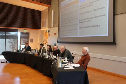 People sitting on a podium