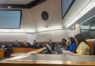 A group of people sitting behind a dais at a government meeting in Santa Clara County, California