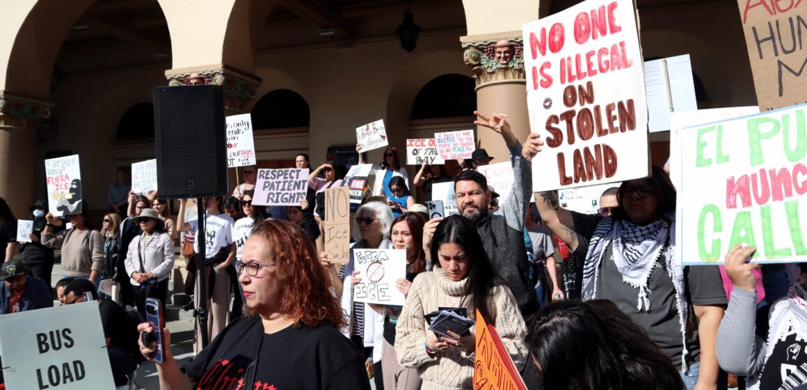 A group of people rally against federal immigration enforcement in San Jose, California