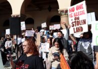 A group of people rally against federal immigration enforcement in San Jose, California