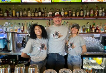 Three restaurant workers looking at the camera