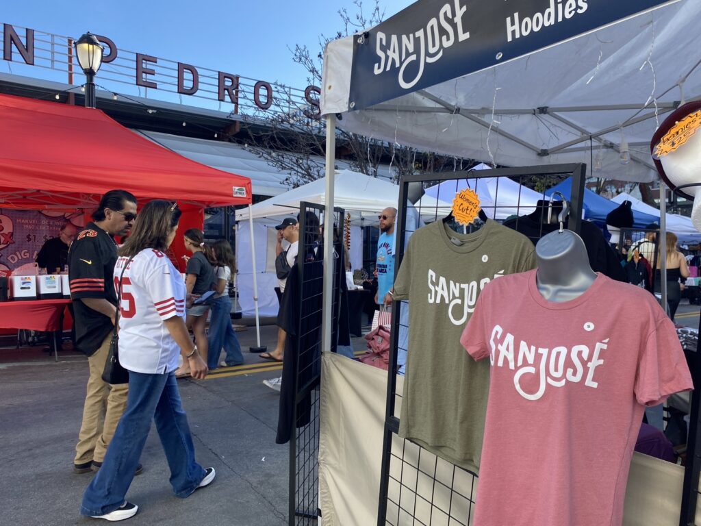 San Jose branded shirts on sale in a vendor market in downtown San Jose.