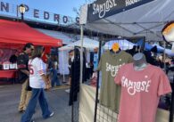 San Jose branded shirts on sale in a vendor market in downtown San Jose.