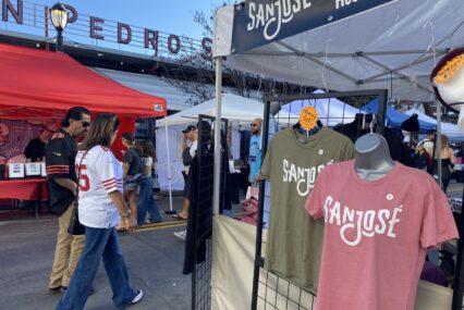 San Jose branded shirts on sale in a vendor market in downtown San Jose.