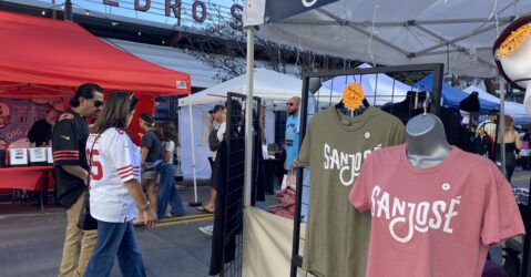 San Jose branded shirts on sale in a vendor market in downtown San Jose.