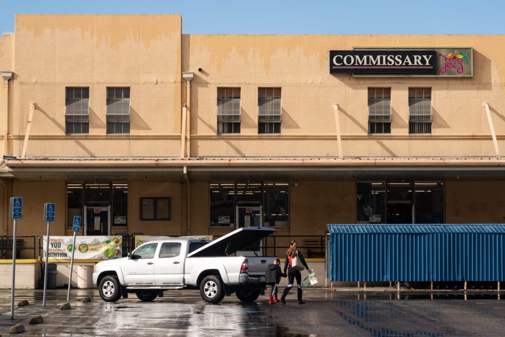A woman and boy walking into building