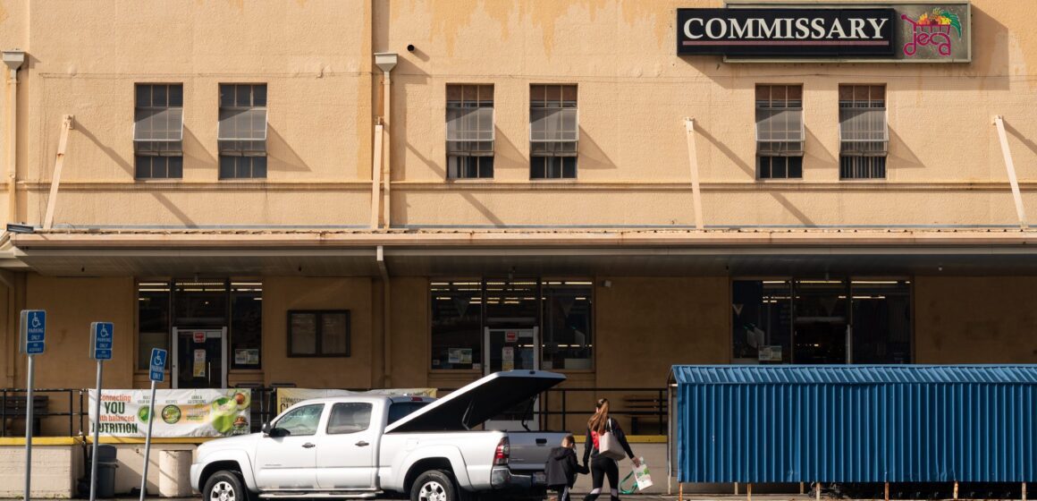 A woman and boy walking into building