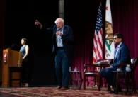 U.S. Senator Bernie Sanders and Rep. Ro Khanna on stage during a town hall on artificial intelligence at Stanford University in California
