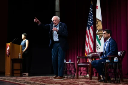 U.S. Senator Bernie Sanders and Rep. Ro Khanna on stage during a town hall on artificial intelligence at Stanford University in California