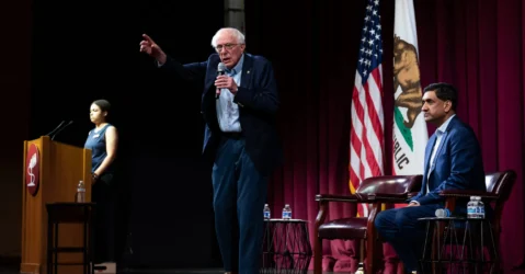 U.S. Senator Bernie Sanders and Rep. Ro Khanna on stage during a town hall on artificial intelligence at Stanford University in California