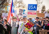 Protesters holding signs in Santa Clara, California