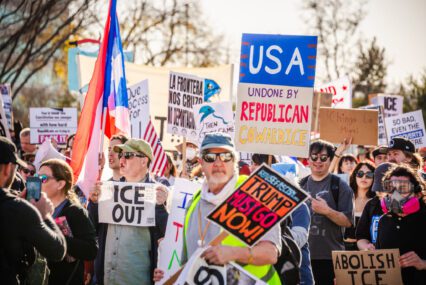 Protesters holding signs in Santa Clara, California