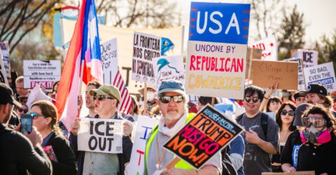 Protesters holding signs in Santa Clara, California