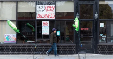 Man walking by vacant stores in Mountain View, California