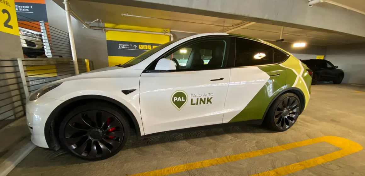 A ride-share vehicle parked in a parking garage