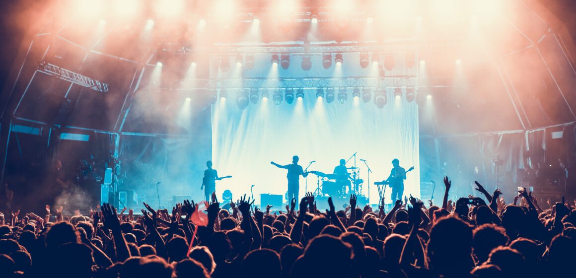 A crowd of people at a live music performance