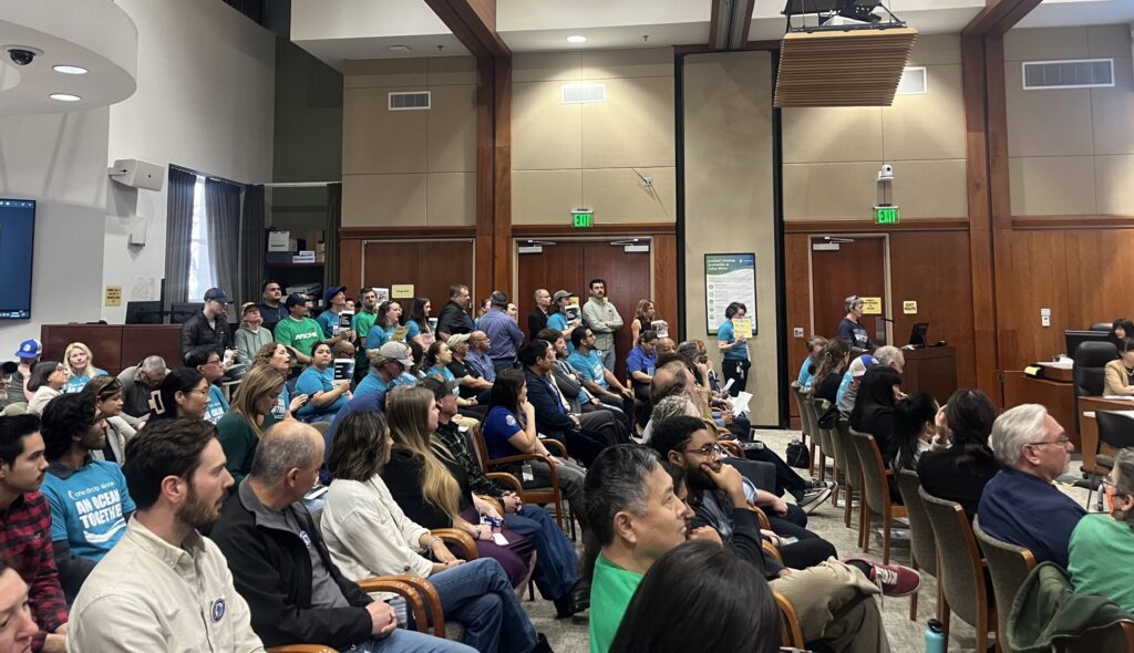 A group of people in chairs at a water board meeting in San Jose, California