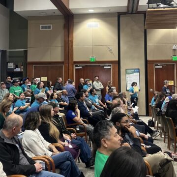 VALLEY WATER A group of people in chairs at a water board meeting in San Jose, California