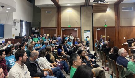 A group of people in chairs at a water board meeting in San Jose, California